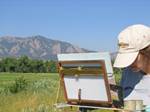 Artist Painting Boulder's Flatirons