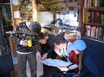 Neil, Teresa, Darin, and Barbara Study a Map of Michigan at Barr Camp - 12-24-2005