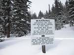 Avalanche blasting waring sign at the BUtler Gulch trialhea near the Henderson Mine, Colorado - 12-27-2008