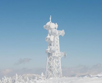 Communications Tower Covered in Snow and Ice