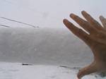 Roger Wendell's hand and snow tube on our telephone wire - 10-26-2006